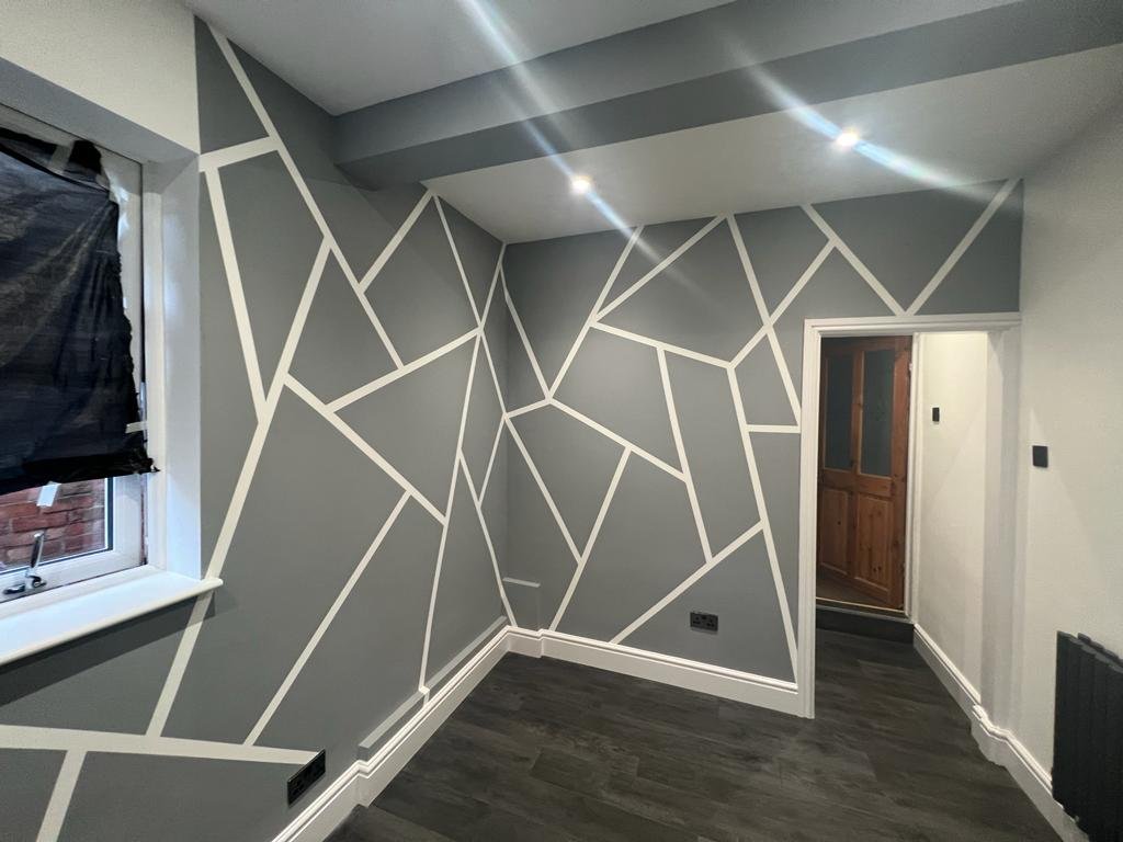 Dark geometric feature walls with contrasting white lines